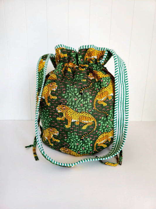 Drawstring bag with leopard pattern on a white background